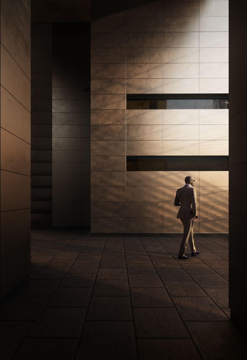 Person walking through a modern building passageway
