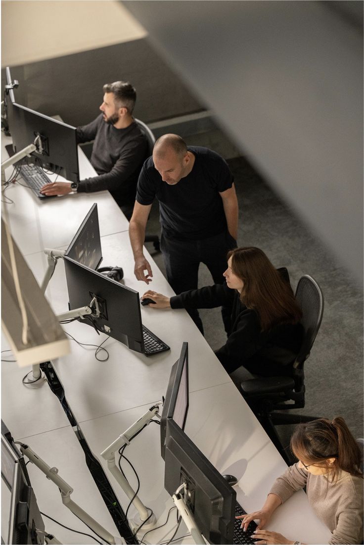 People working at desks in an office workspace